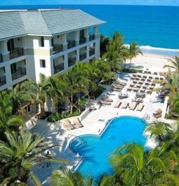 Aerial view of an oceanfront hotel with a pool