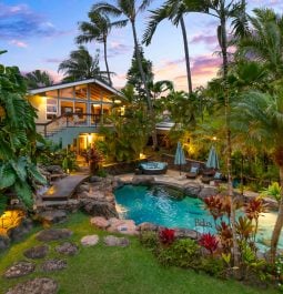 Jungle-clad villa with beautiful flowers and oval shaped pool