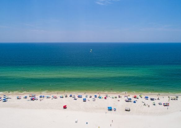 white sand beach next to turquoise ocean