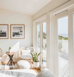 living room facing the ocean with wall of windows