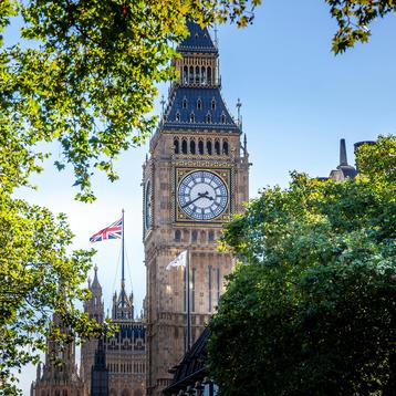 Phot of Elizabeth Tower and UK flag in the background on Houses of Parliament 