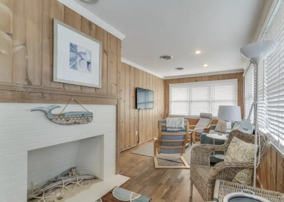 living room with fireplace and various seating areas